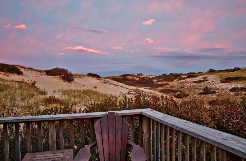 Image of Adirondack chair by the dunes